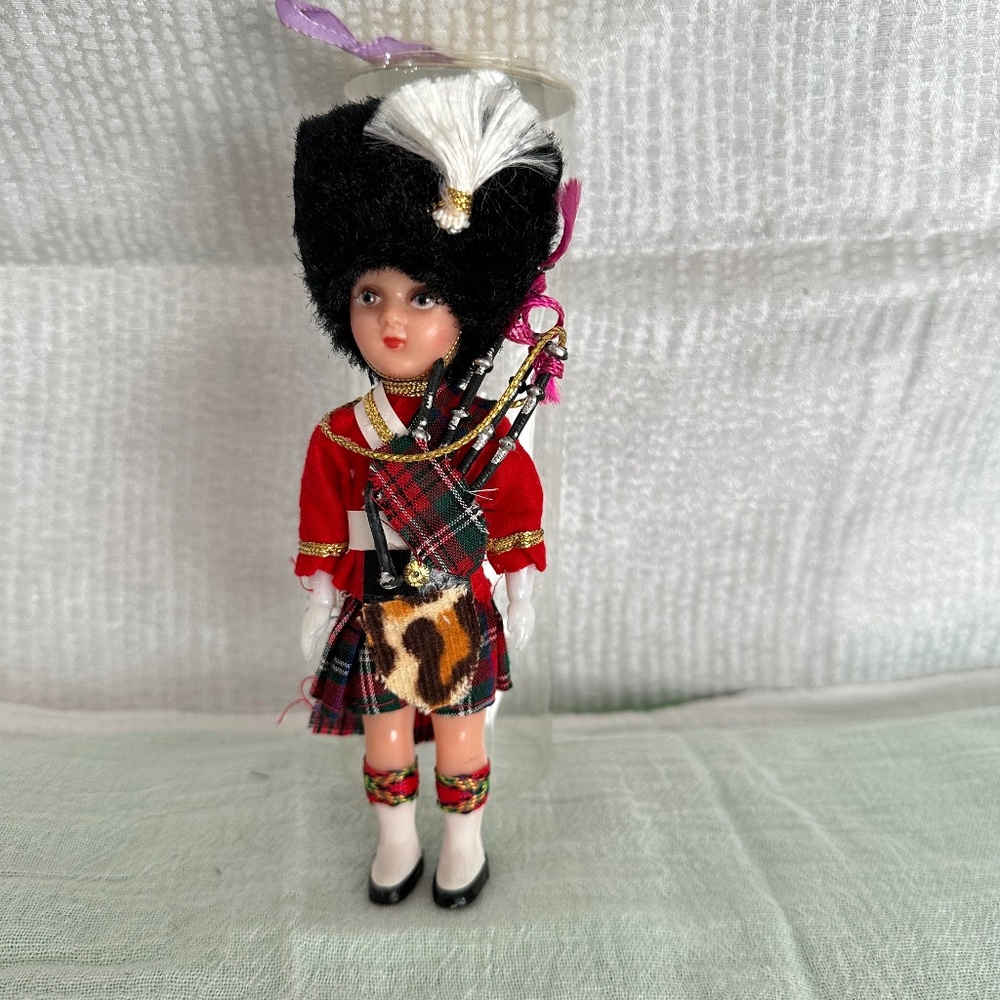 Vintage Scottish souvenir/ collectible doll with bag pipes.